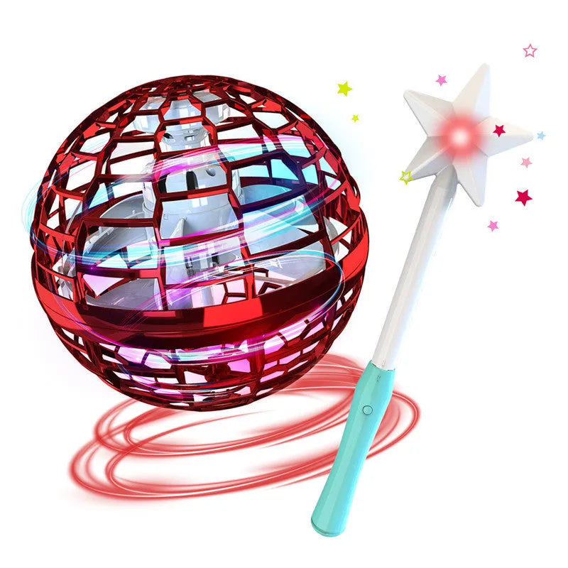 Blue spinning flying ball toy with LED lights hovering above a child's hand, with a magic wand accessory.