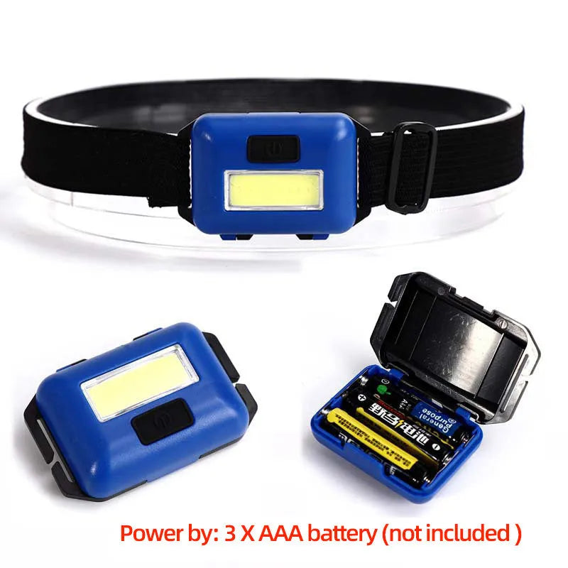 Compact blue outdoor LED headlight with adjustable head strap on a black background.