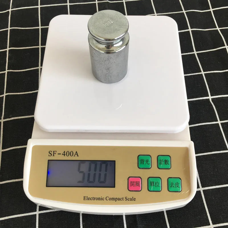 SF-400A black electronic kitchen scale with digital display on a kitchen counter.