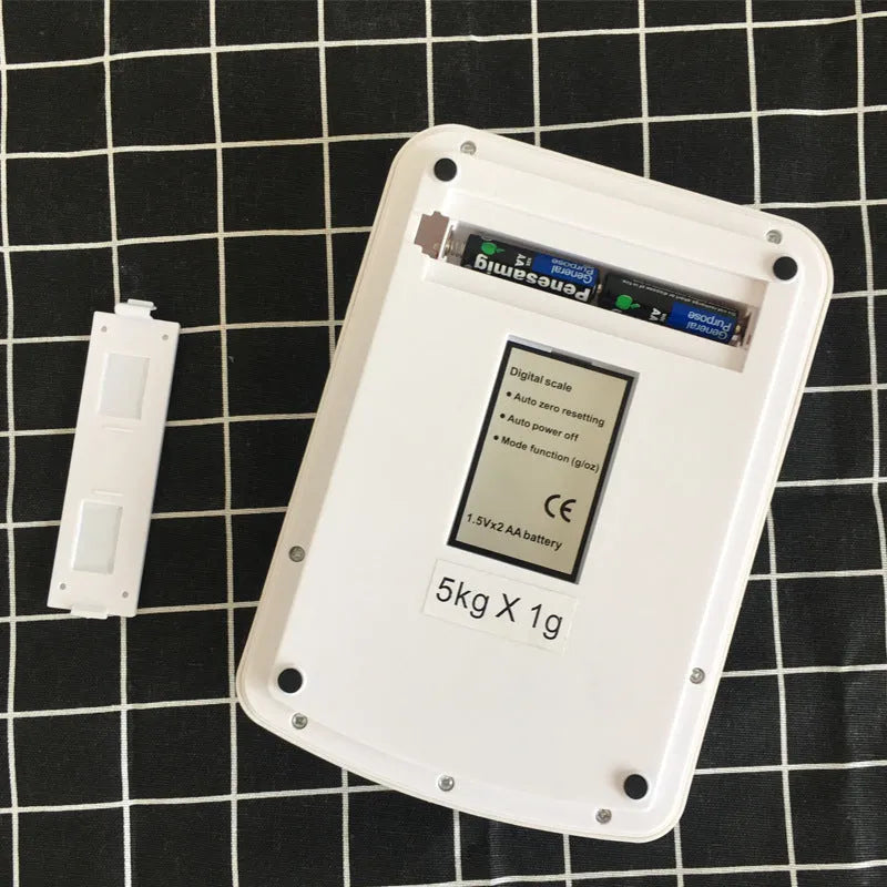 SF-400A black electronic kitchen scale with digital display on a kitchen counter.