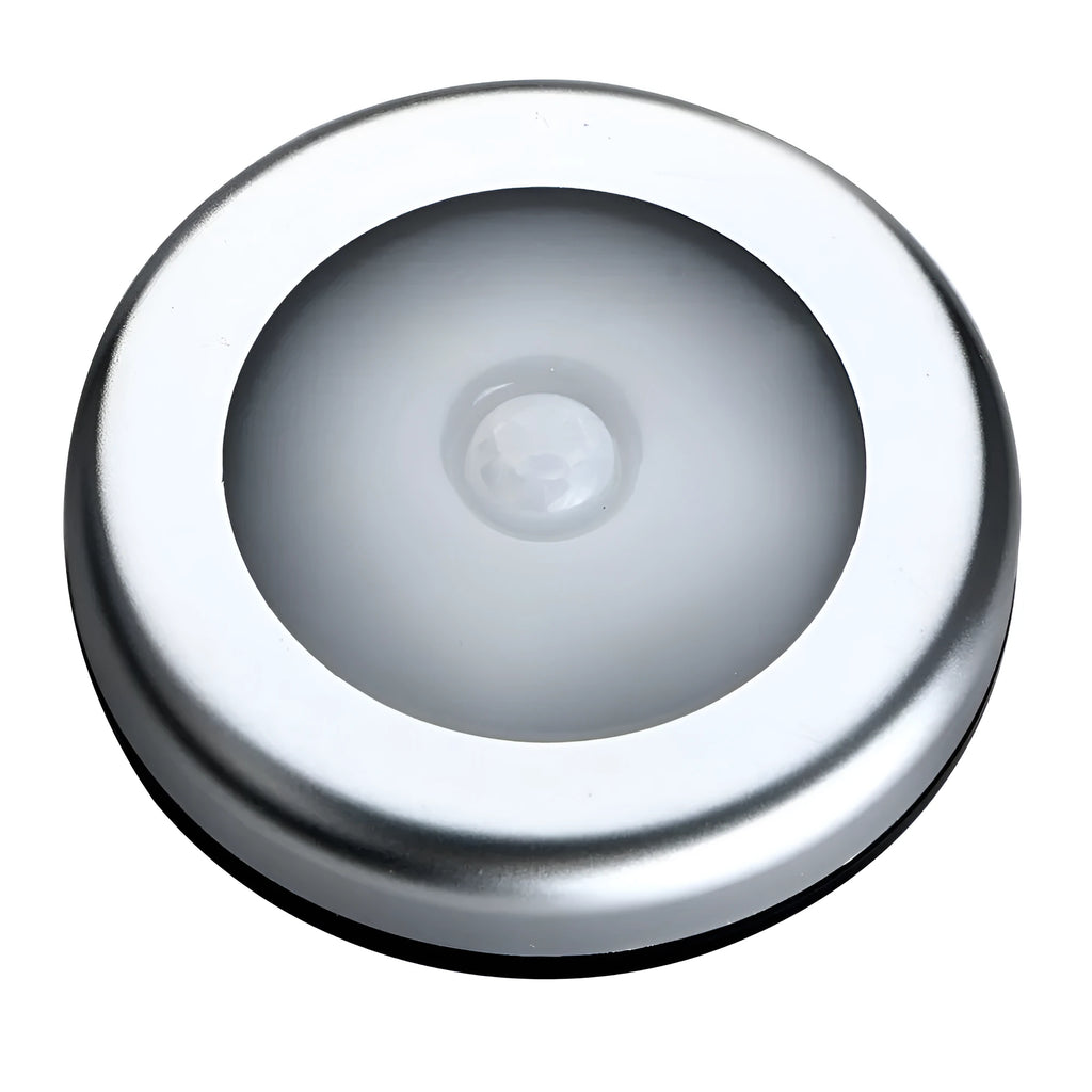 Silver round wireless motion sensor LED night light with adhesive back.