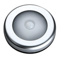 Silver round wireless motion sensor LED night light with adhesive back.