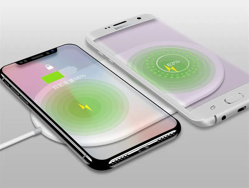 White dual mobile phone wireless charger charging two phones simultaneously