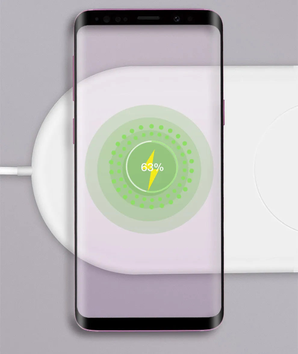 White dual mobile phone wireless charger charging two phones simultaneously