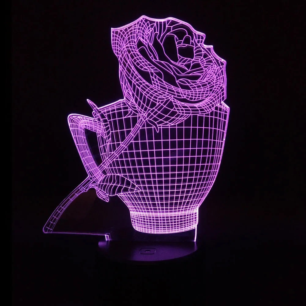 3D rose design acrylic night light with ABS base on a table, showing multi-coloured LED illumination.