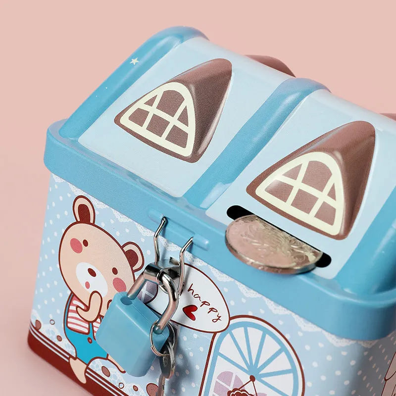 Blue house-shaped tinplate piggy bank for coin storage measuring 112mm wide