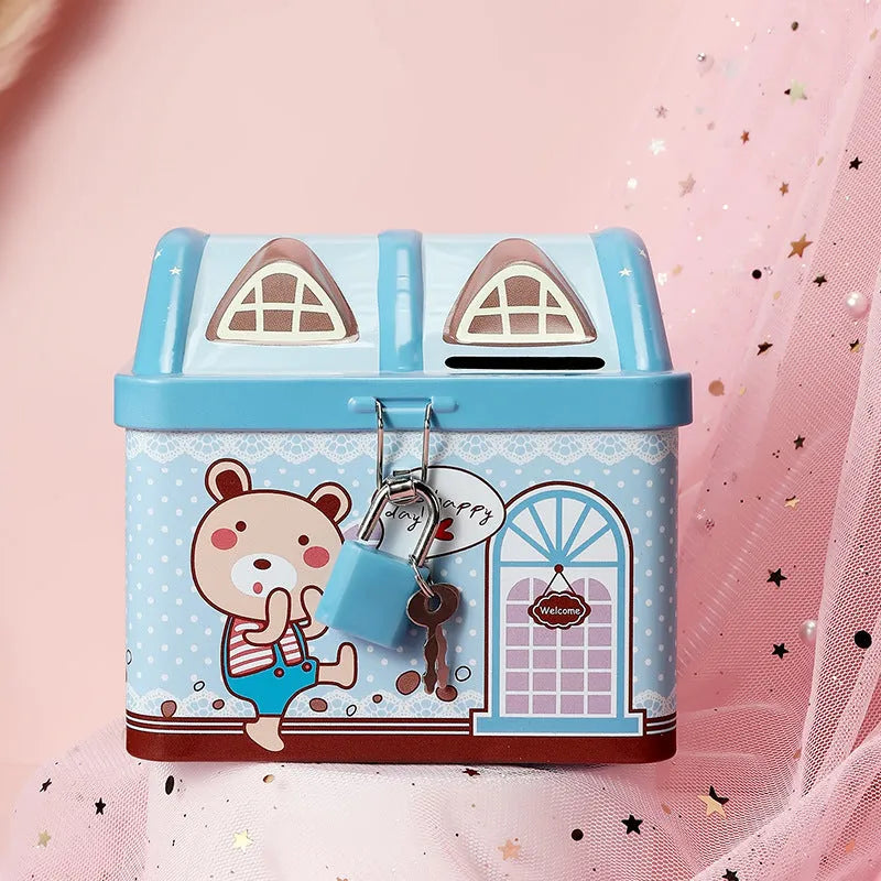 Blue house-shaped tinplate piggy bank for coin storage measuring 112mm wide