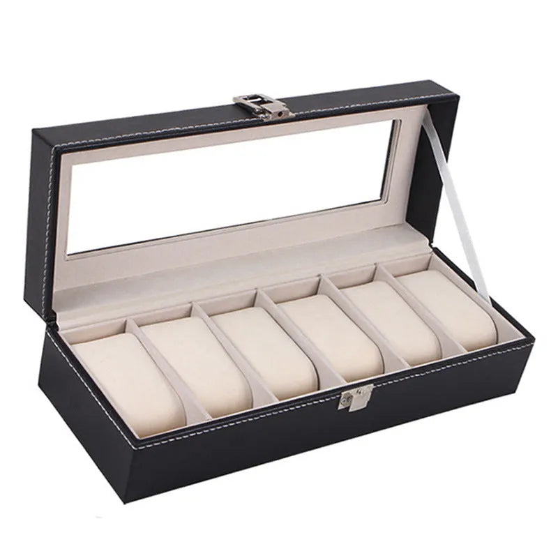 Black wooden watch display box with clear lid showing six individual watch storage compartments.