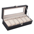 Black wooden watch display box with clear lid showing six individual watch storage compartments.
