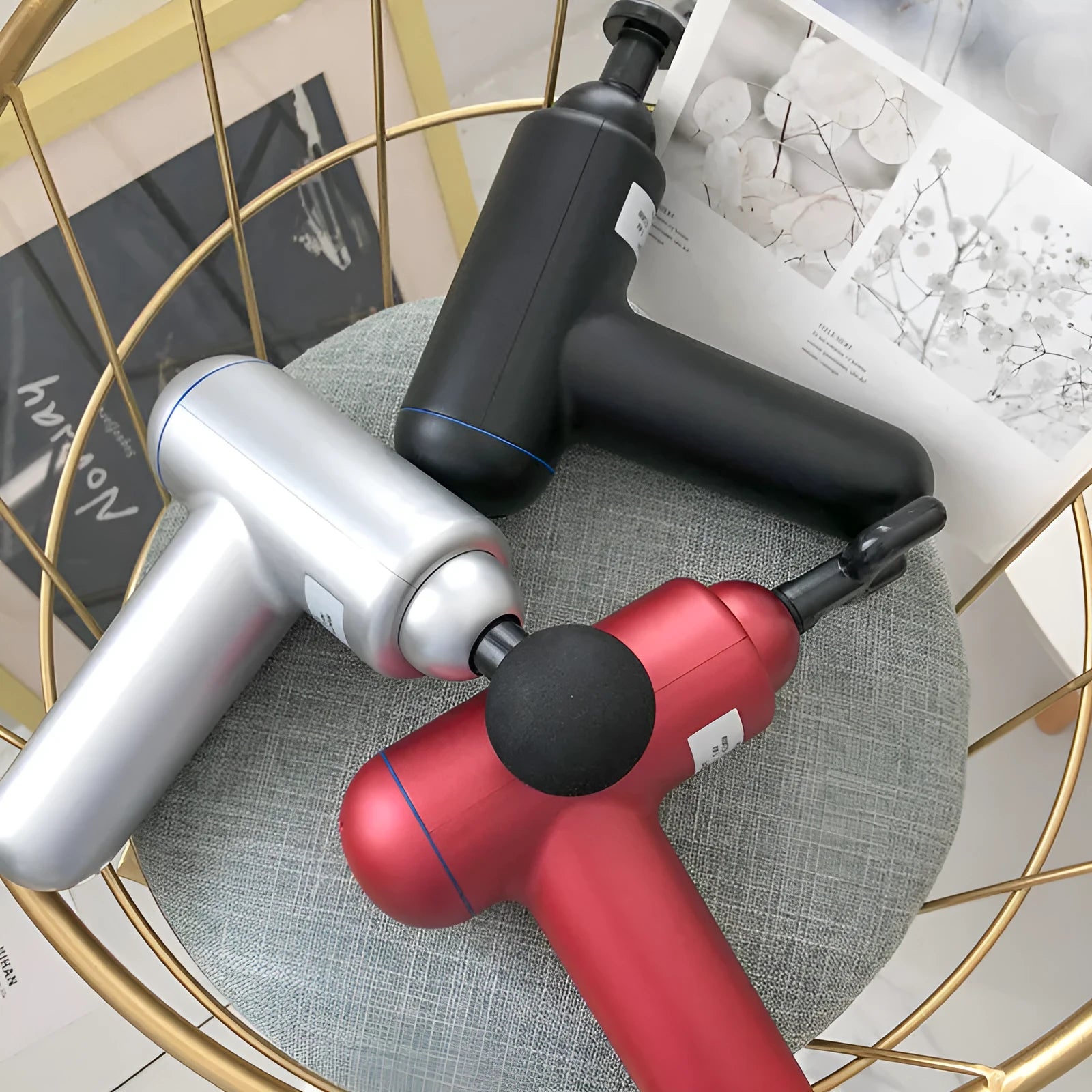 God fascia gun muscle massager in black, red, and white colour options showing handheld design and massage head.