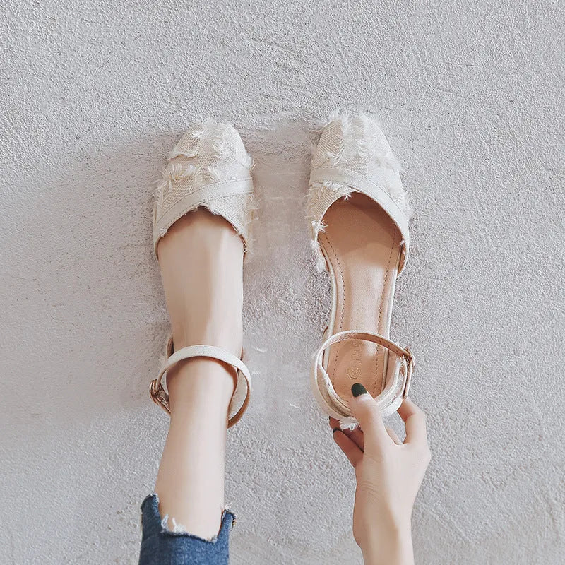 Women's flats with ankle strap and Dorsay low heel design in suede material