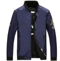 Men's reversible flight jacket in black, blue, or green colours with thin stripe pattern and zipper closure