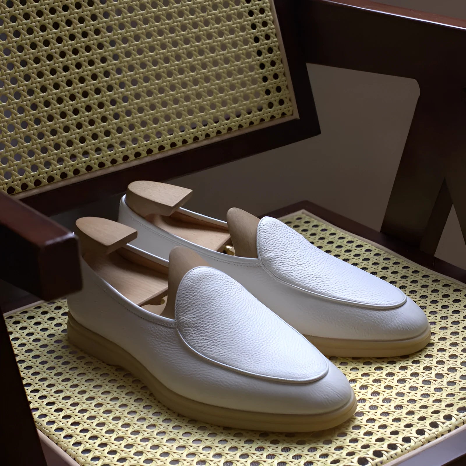 Men's brown genuine leather loafers with a TPR sole on a white background.