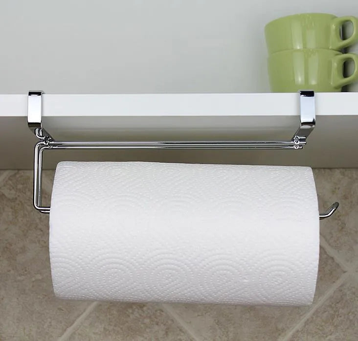 Silver stainless steel paper towel rack mounted on kitchen cabinet door