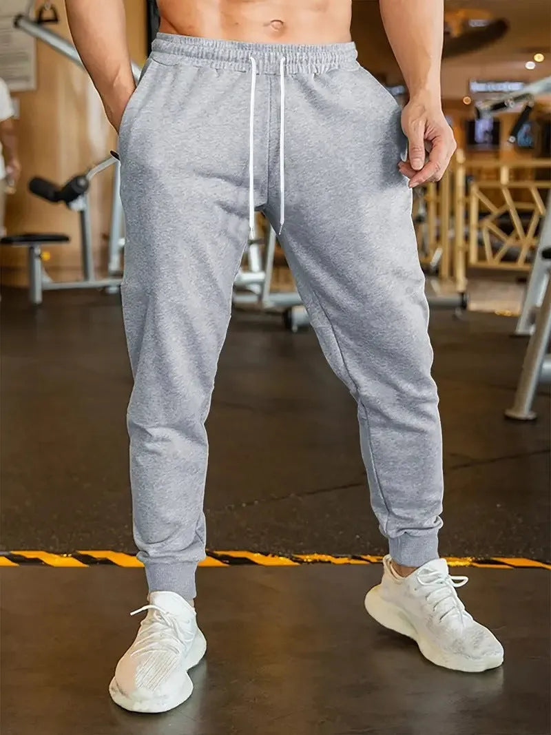 Men's loose-fit linen style leisure trousers with an elastic drawstring waist.
