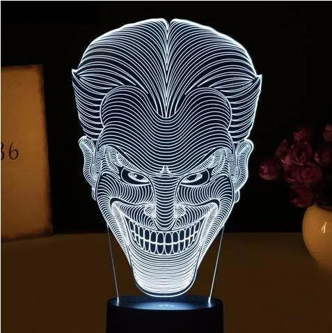 3D acrylic LED lamp on a base showing multi-colour gradient lighting, with a USB cable and remote control.