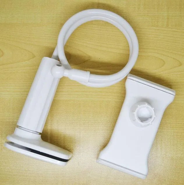Black adjustable bedside phone holder with long arm on a table