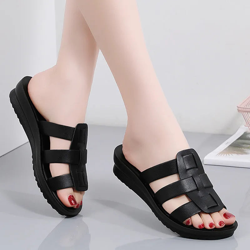 Beige women's flat-bottom slippers with a PU leather toe and soft sole.