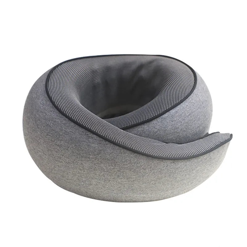 U-shaped memory foam travel neck pillow in a storage bag, shown in dark grey colour.