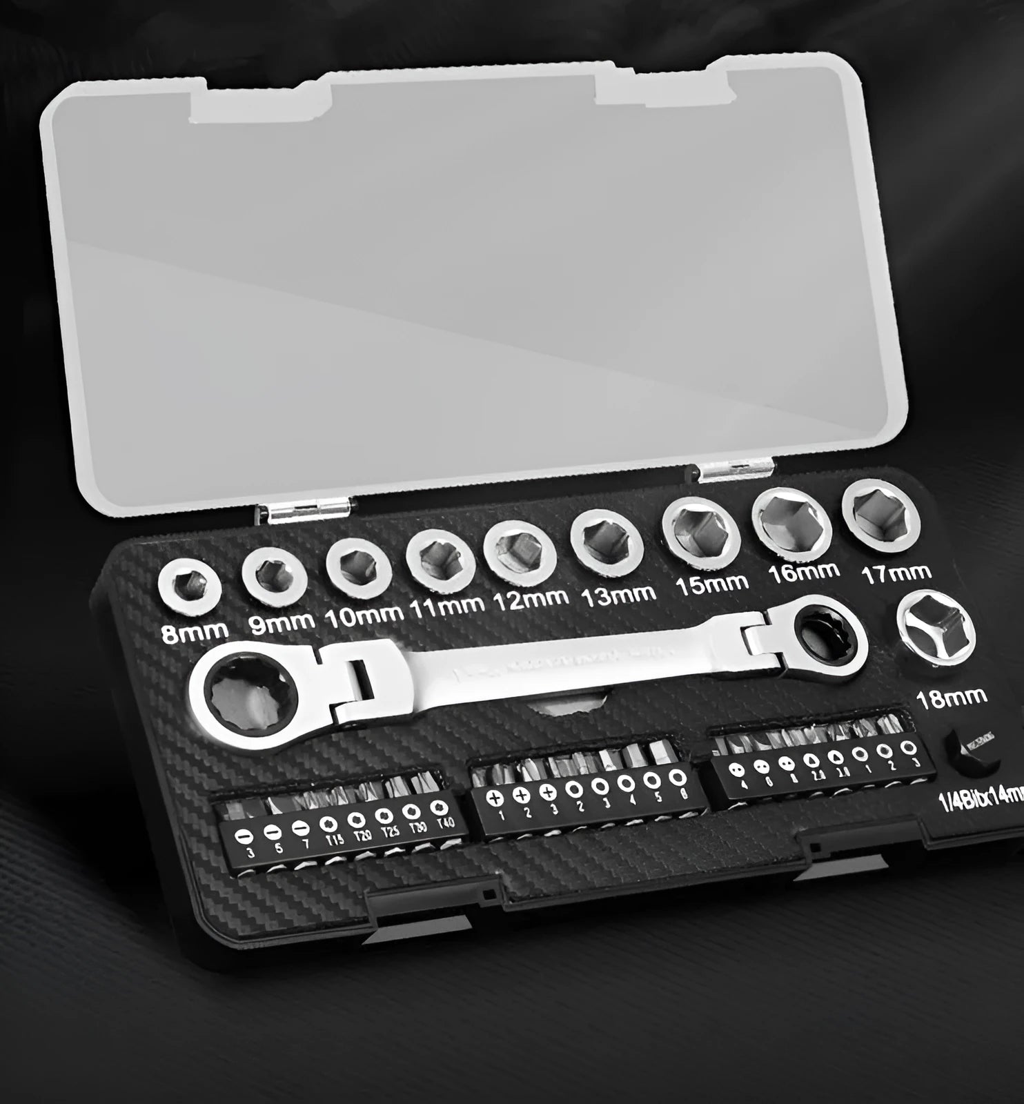 Professional ratchet wrench set with 1/4-inch drive, multiple sockets, and bit heads on a workbench.