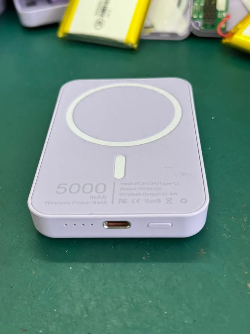 White magnetic wireless power bank with stand functionality showing 5000mAh capacity