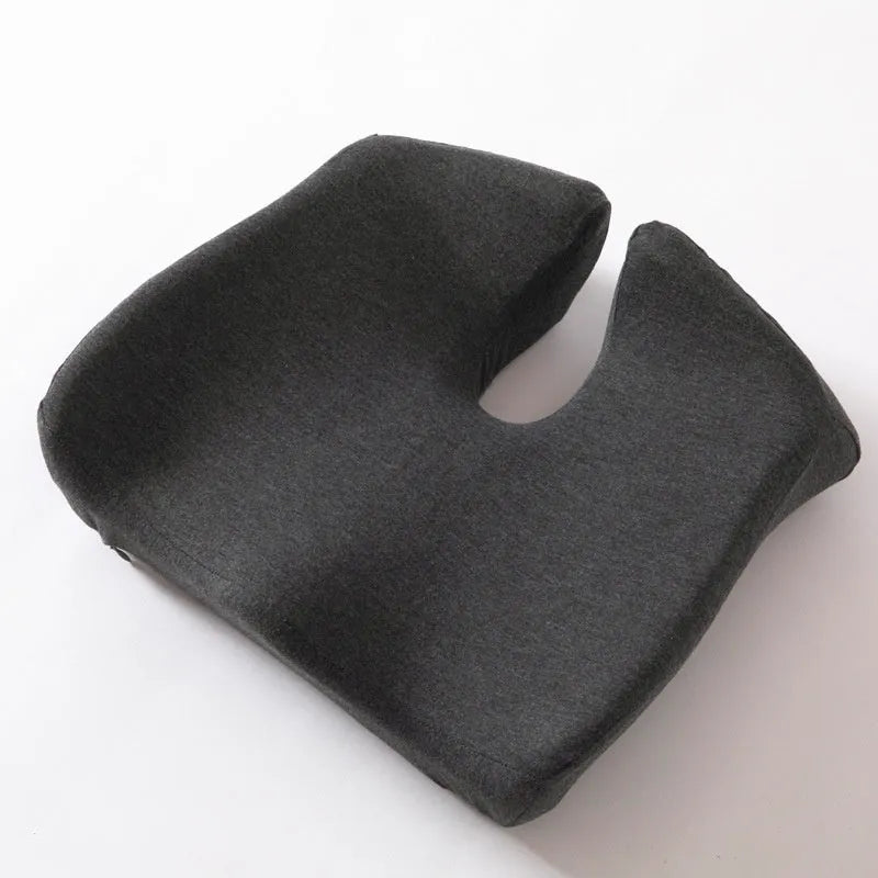 Black memory foam office chair cushion with dimensions 36x40cm on a grey desk chair