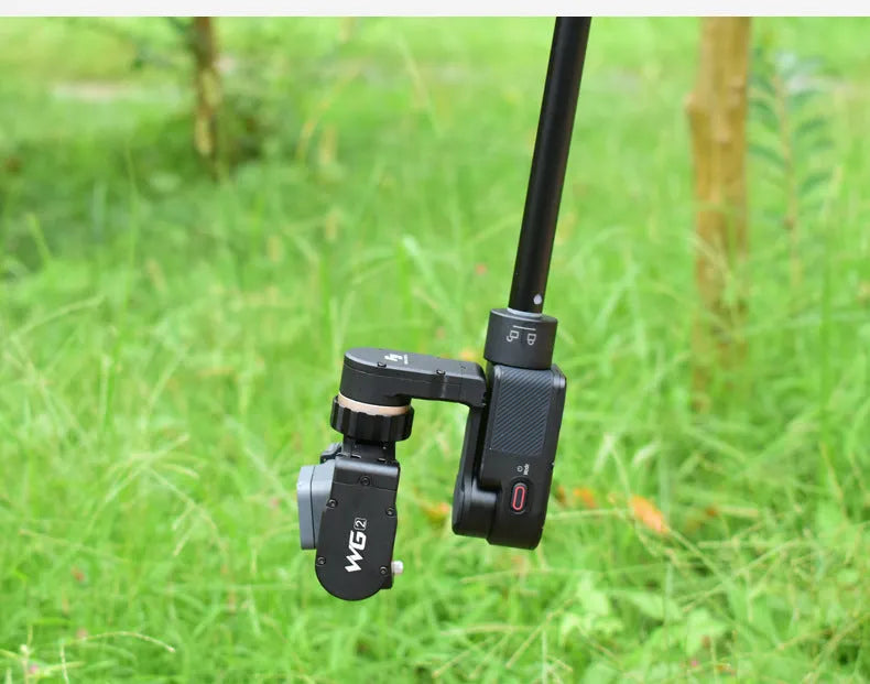 Black retractable hand-held stabilizer selfie stick extended for smartphone photography