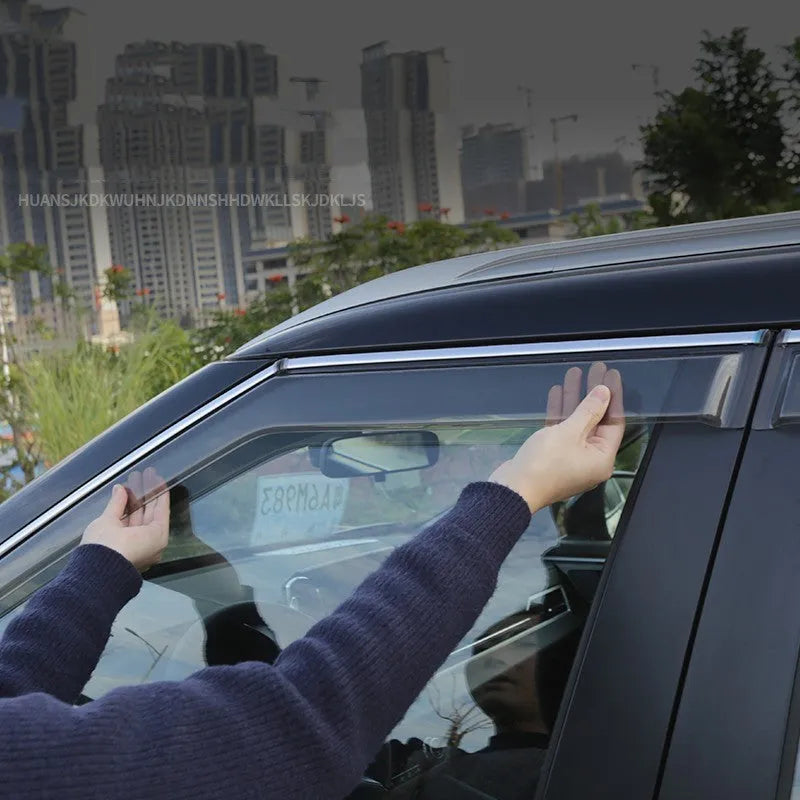 2023 Mitsubishi Outlander black and translucent window deflectors installed on vehicle exterior