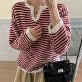 Red and blue striped cashmere pullover sweater for women with loose fit and long sleeves.