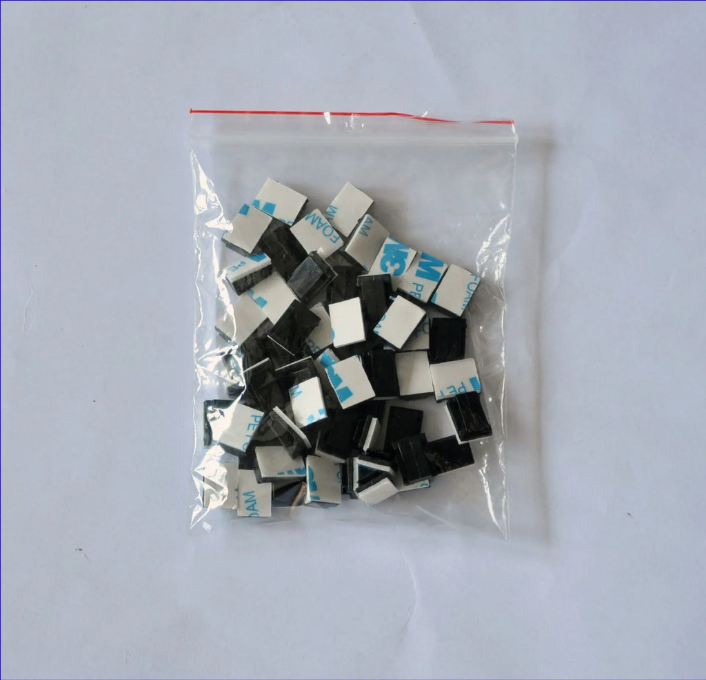 Black PA66 nylon cable management clip for automotive and electronic wiring.