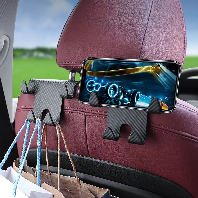 Black ABS plastic car hook and phone holder bracket mounted behind a car seat headrest.