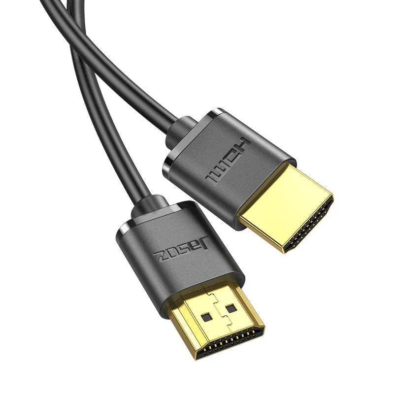 Gold-plated HDMI cable with thin black wire, shown with connector close-up highlighting contacts.
