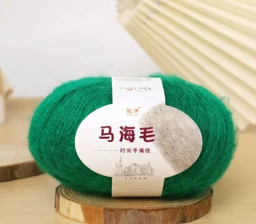 Single ball of mohair yarn in various colours for hand-woven DIY scarf knitting projects