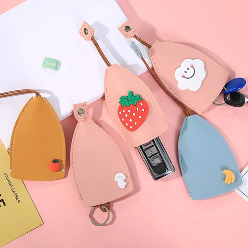 Cartoon pull-out car key case in PU leather with colourful designs measuring 14 x 7.5 cm