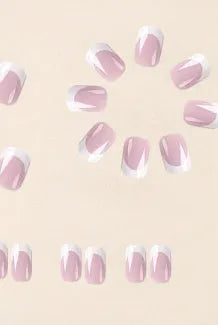24 white false nail tips with a plaid pattern, laid out on a surface