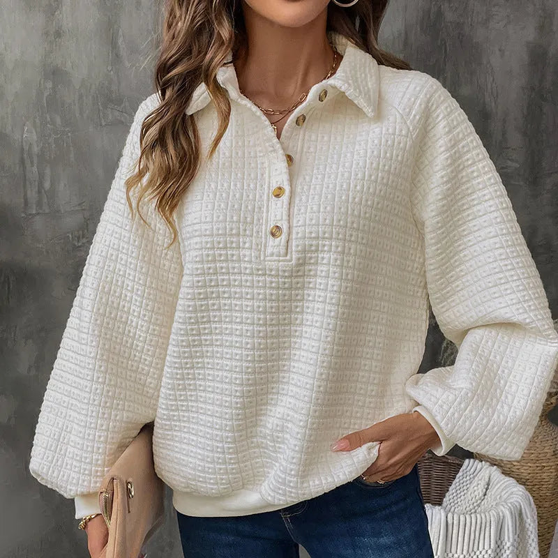 Women's milky white sweater with a polo collar and long sleeves laid flat.