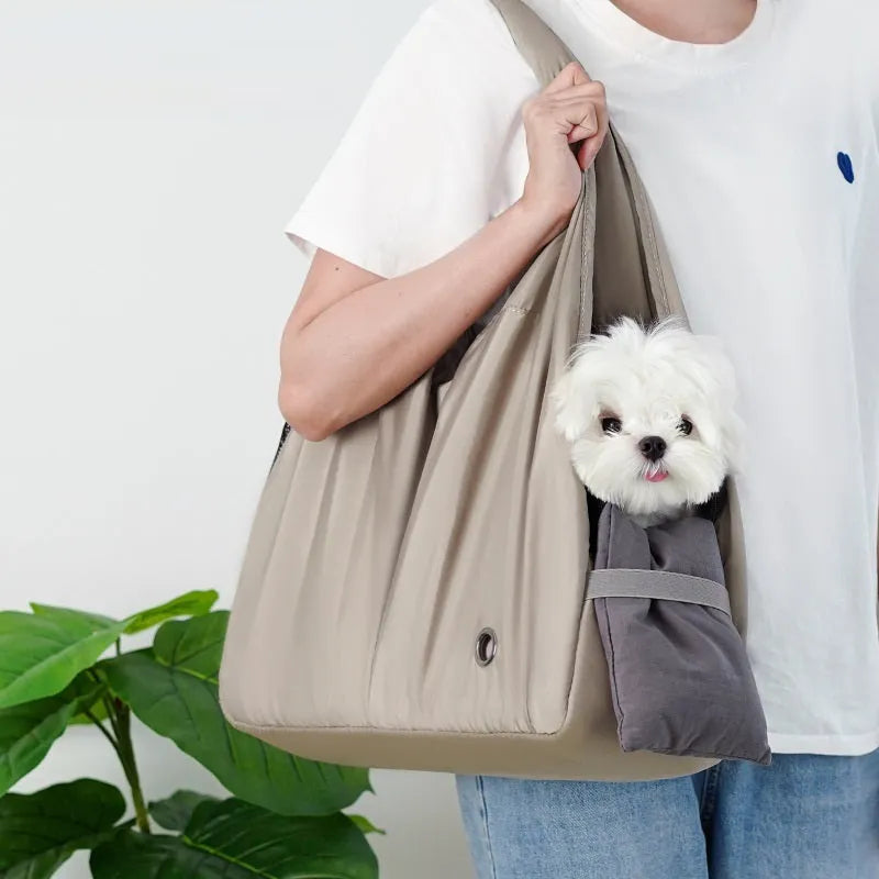 Apricot coloured cloth pet carrier handbag showing breathable fabric and portable design