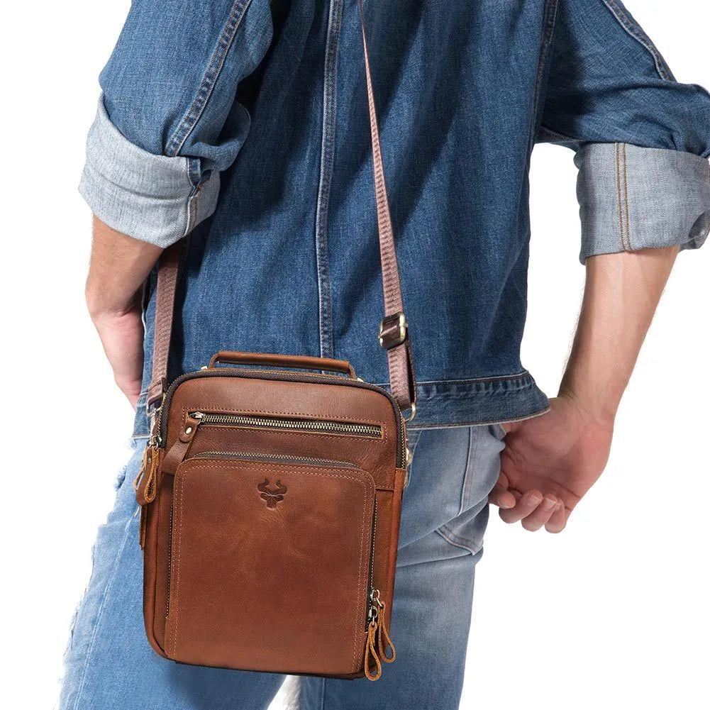Men's brown leather crossbody bag with single-shoulder design showing sewing line details and business travel style