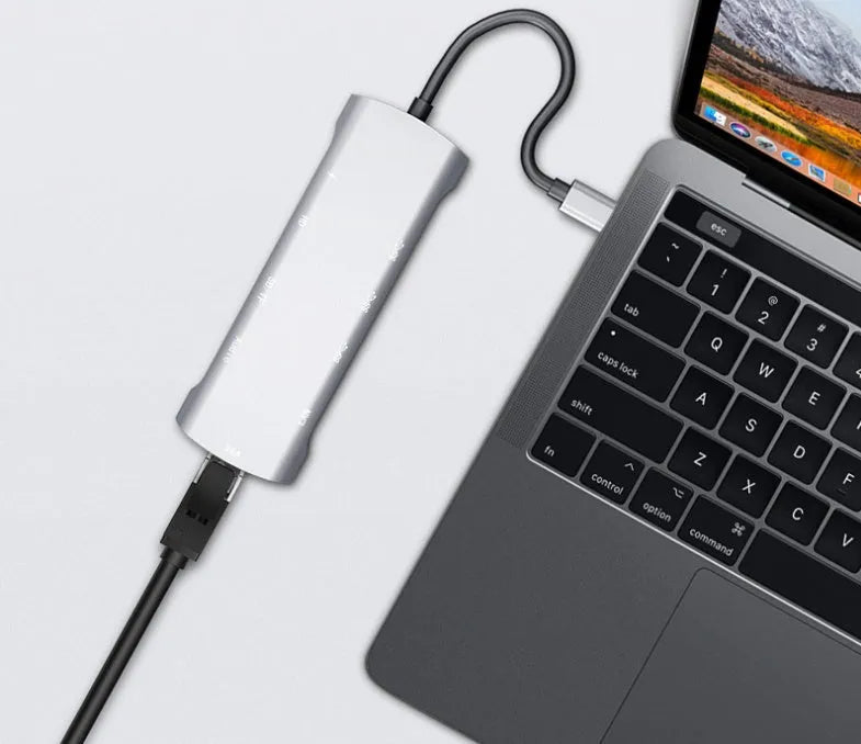 Grey aluminium USB-C docking station with HDMI, VGA, USB and charging ports