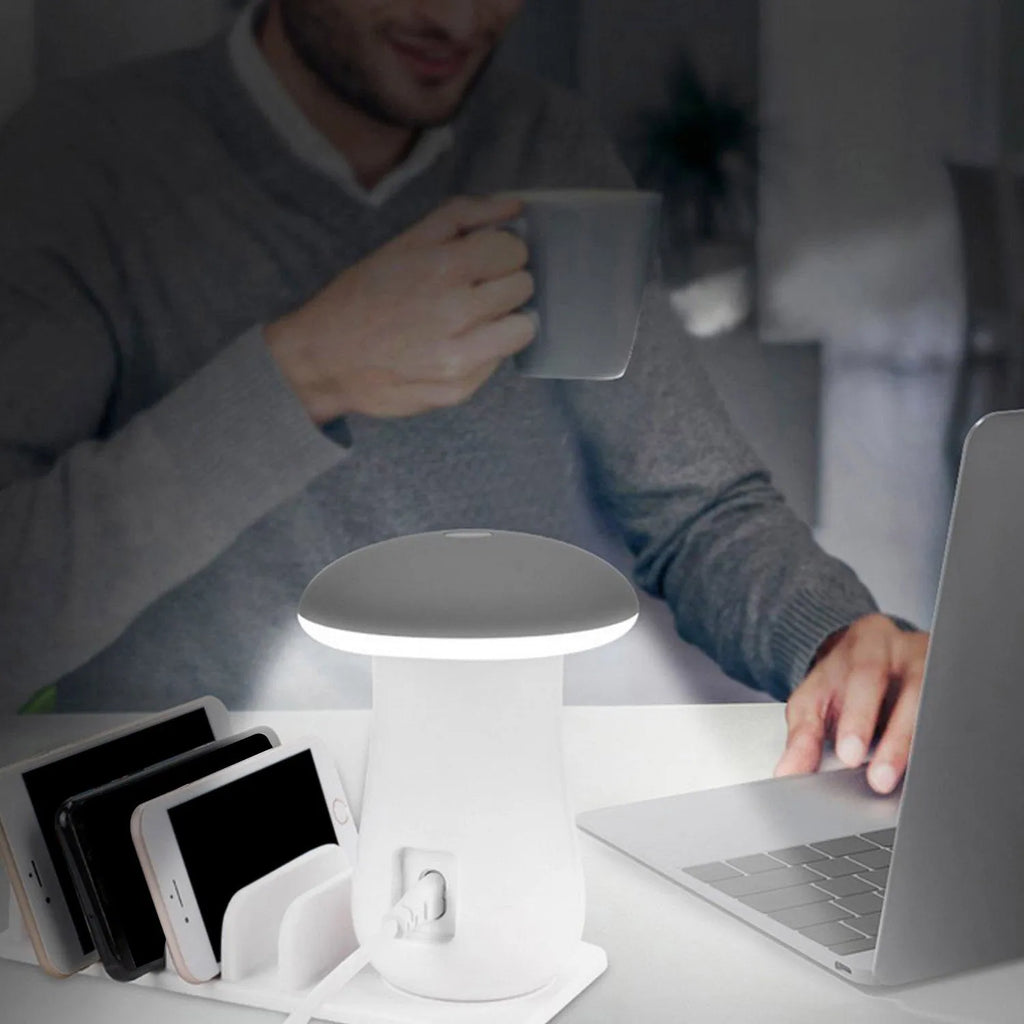 White mushroom-shaped USB charging dock station with five ports and a glowing LED light on a desk.