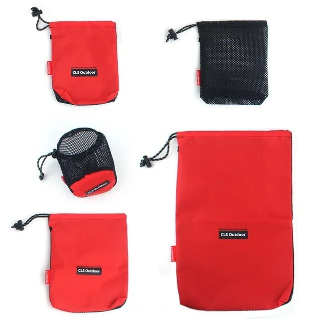 Red five-piece travel toiletry bag set with zipper closures and mesh panels