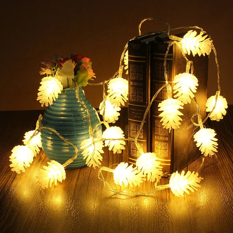 Warm white LED pine cone fairy lights on a string, powered by batteries for cord-free decoration.