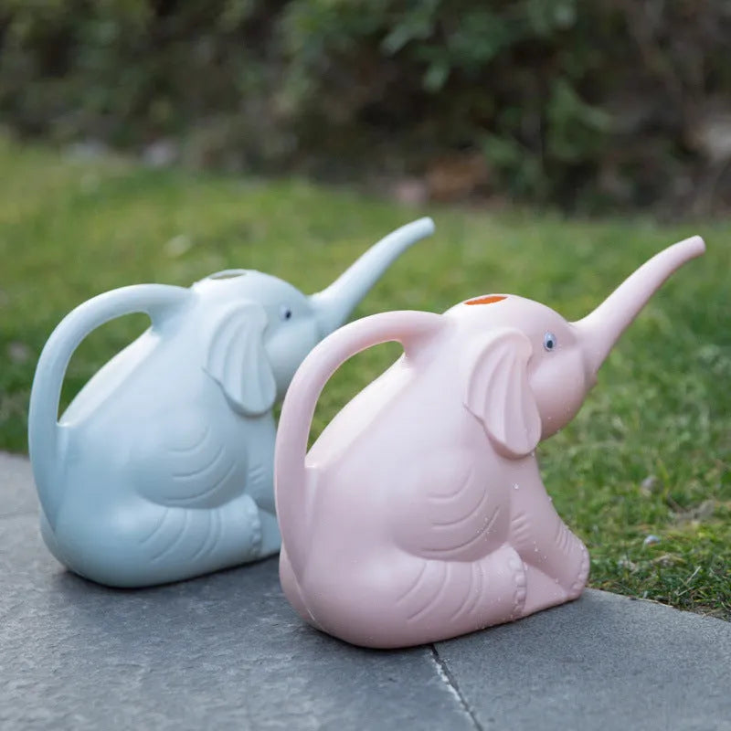 Pink children's elephant-shaped watering can with a long nozzle and baby bottle handle.
