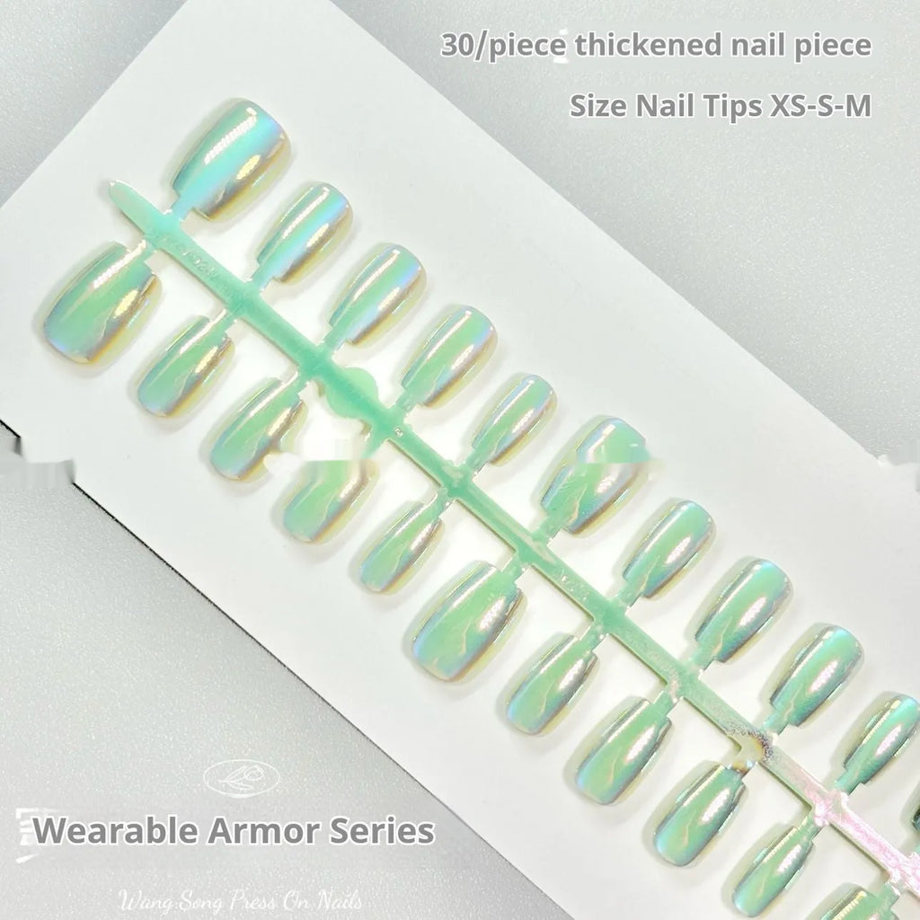 Electroplated Cat's Eye false nail set showing Aurora, solid colour, and gemstone-effect styles in short ladder sizes.