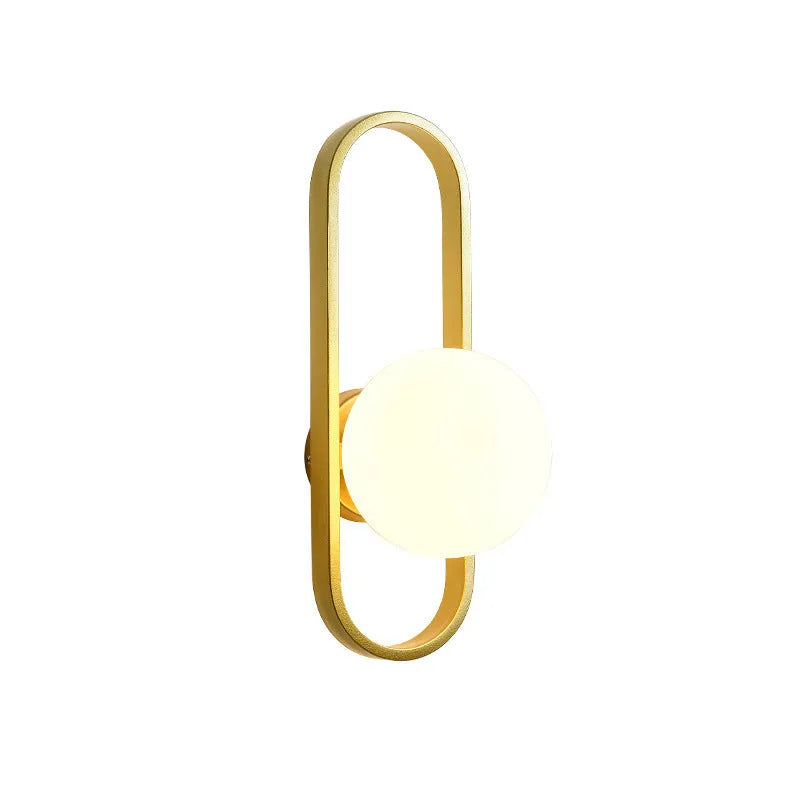 Minimalist modern wall lamp with glass shade and iron body in black finish, mounted on a wall.