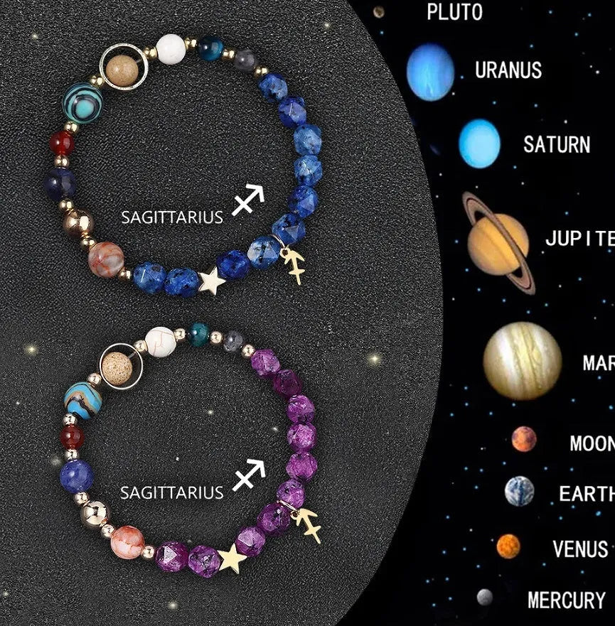 Set of two natural stone beaded bracelets with metal zodiac charms on a dark background.