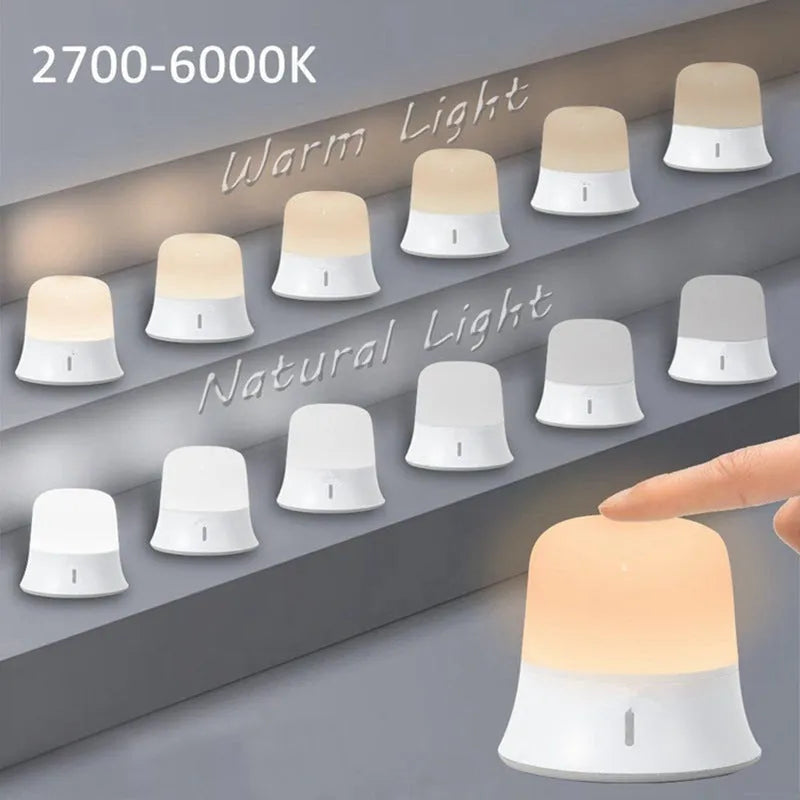 White touch-control bedside night light with rechargeable battery shown next to a USB cable.
