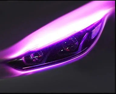 Universal car LED daytime running light strip with flowing turn signal on a vehicle headlight.