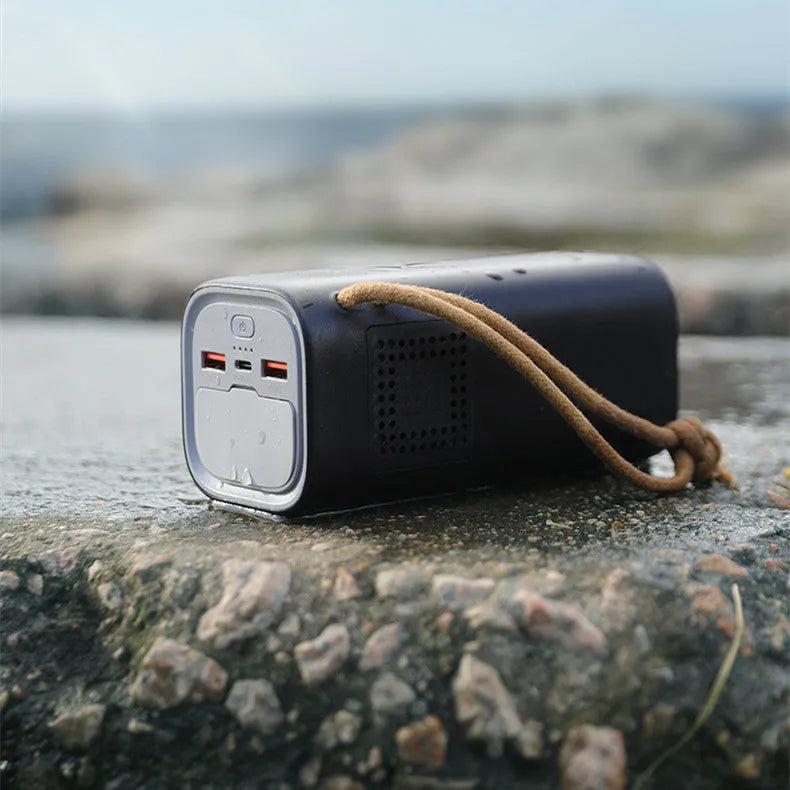 Black portable power bank with 20000mAh capacity and 220V output for outdoor use