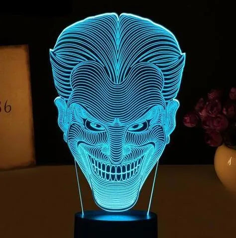 3D acrylic LED lamp on a base showing multi-colour gradient lighting, with a USB cable and remote control.